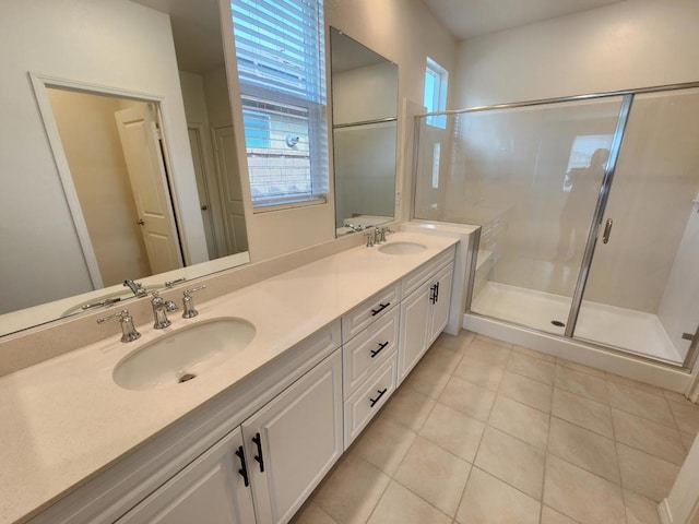 bathroom featuring tile patterned floors, vanity, and an enclosed shower