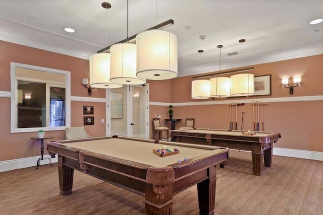 rec room with hardwood / wood-style flooring, ornamental molding, and billiards