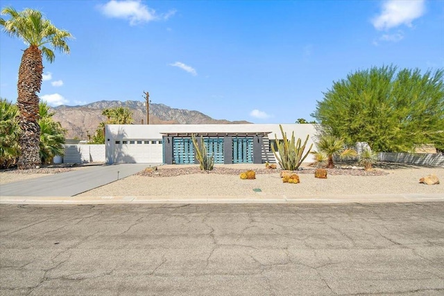 view of front of house featuring a mountain view and a garage