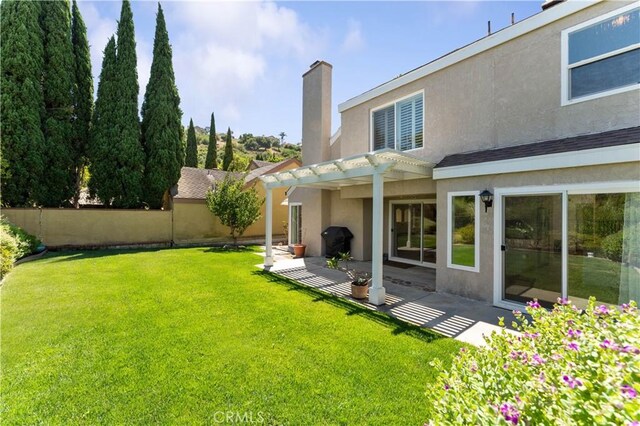 view of yard featuring a pergola and a patio