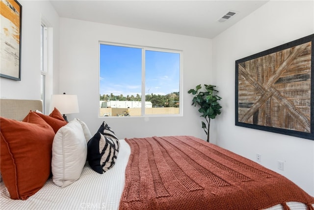 bedroom featuring visible vents