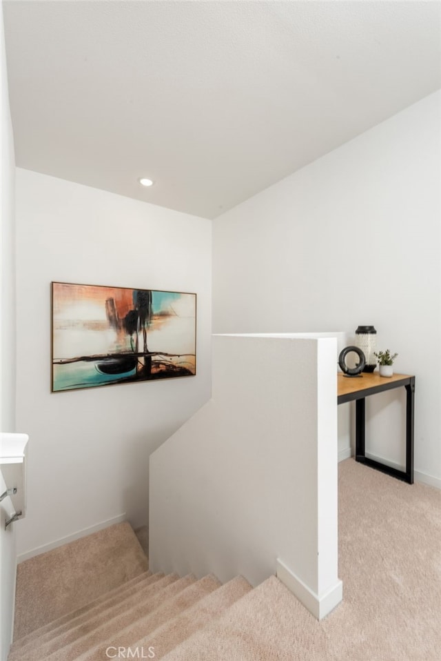 staircase featuring carpet, baseboards, and recessed lighting