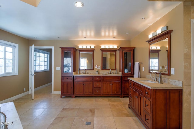 bathroom with vanity and tile patterned flooring