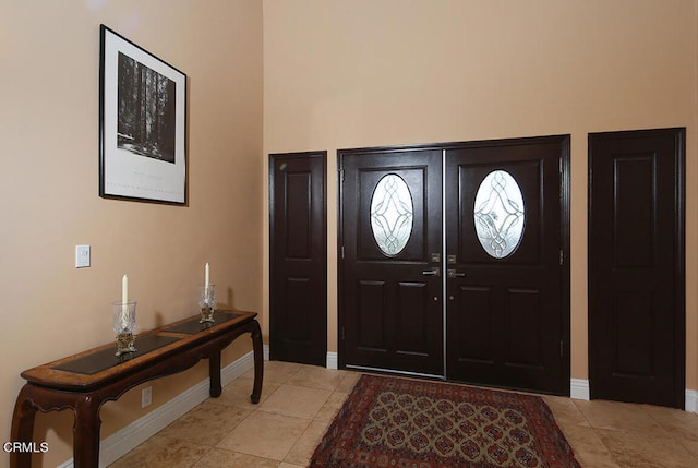 foyer with light tile patterned floors