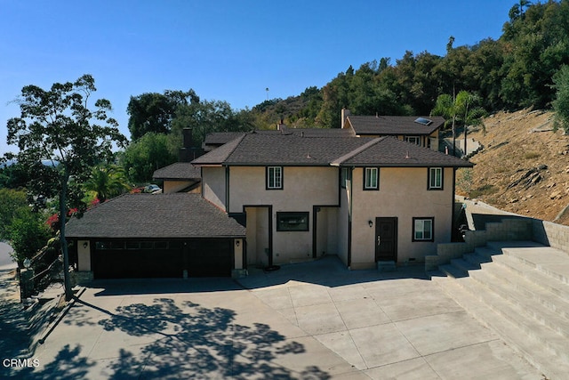 view of front of property with a garage