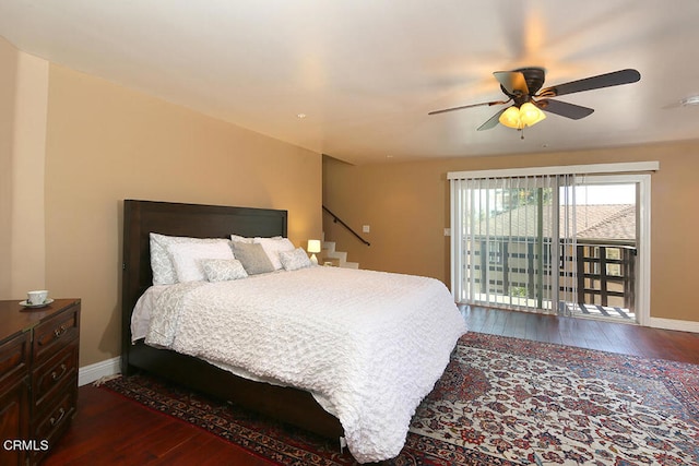 bedroom with hardwood / wood-style floors, access to outside, and ceiling fan