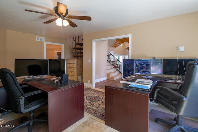 office featuring ceiling fan and light tile patterned floors