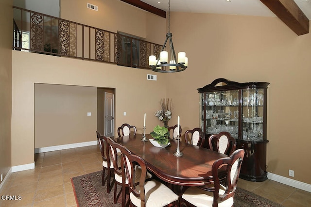 tiled dining room with high vaulted ceiling, an inviting chandelier, and beamed ceiling