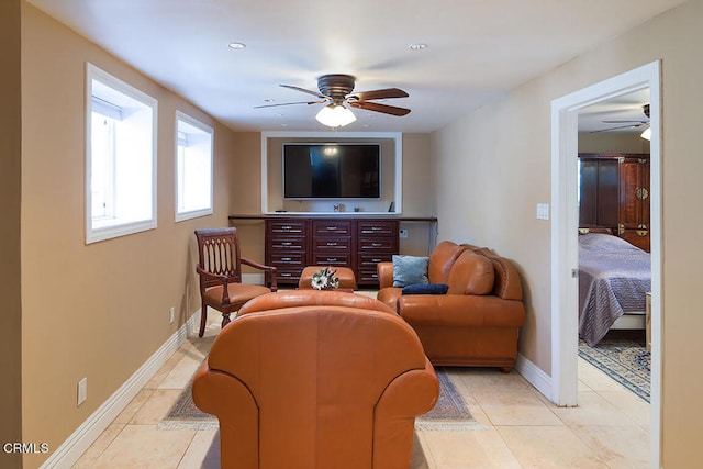 living room featuring ceiling fan and light tile patterned flooring