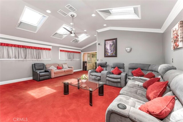 living room with lofted ceiling with skylight, carpet, ornamental molding, and ceiling fan