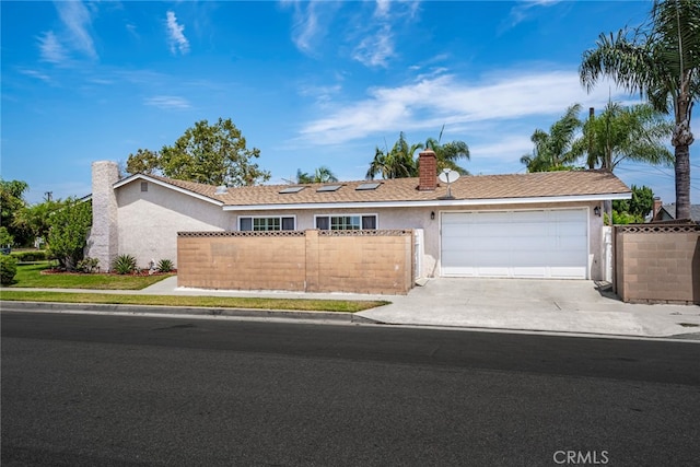 single story home featuring a garage