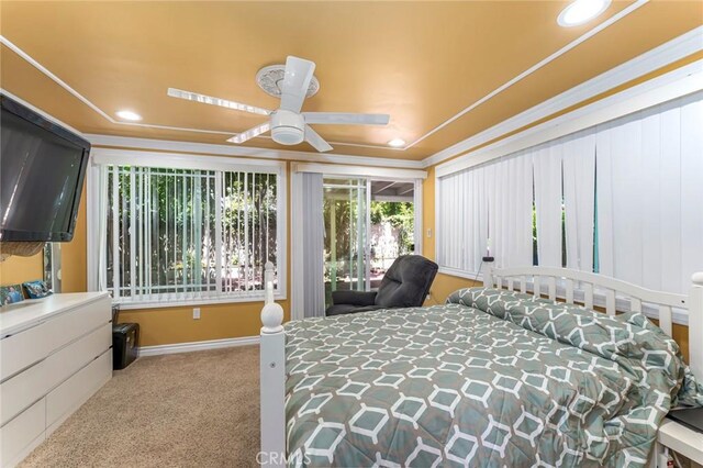 bedroom featuring ceiling fan and light carpet