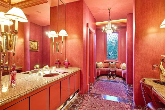 bathroom featuring tile patterned floors, vanity, and a chandelier