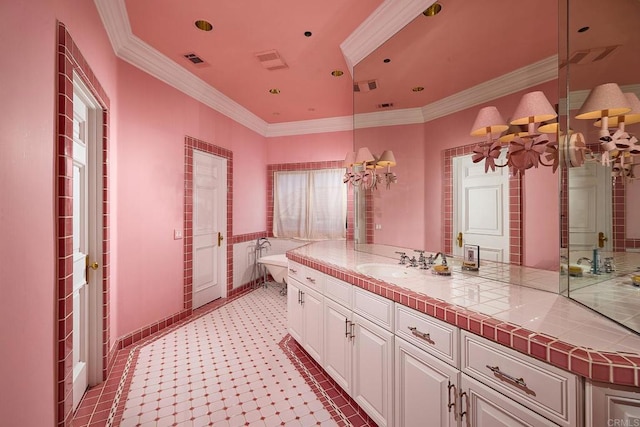 bathroom featuring tile patterned flooring, vanity, an inviting chandelier, and crown molding