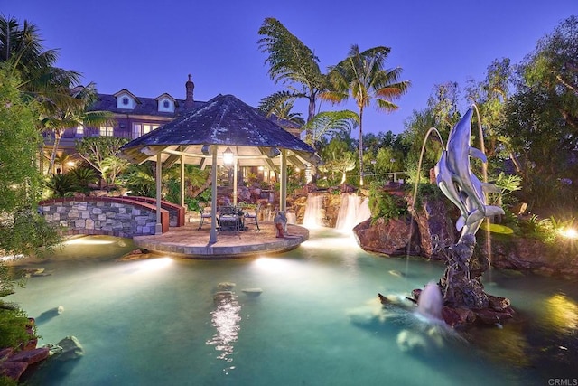 view of pool with a patio and a gazebo