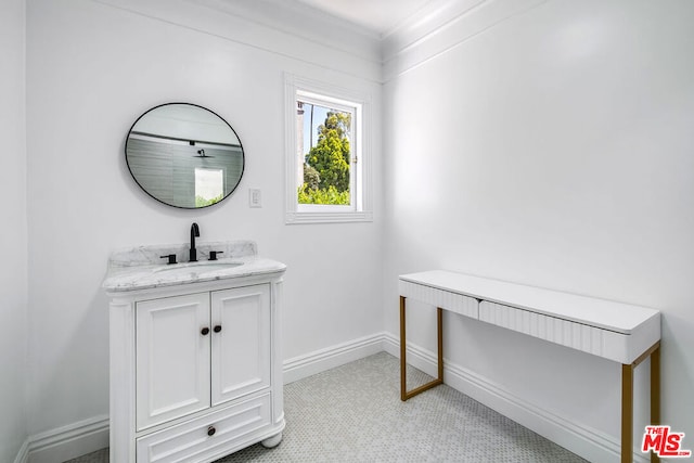 bathroom with tile patterned floors and vanity