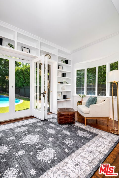 unfurnished sunroom featuring french doors