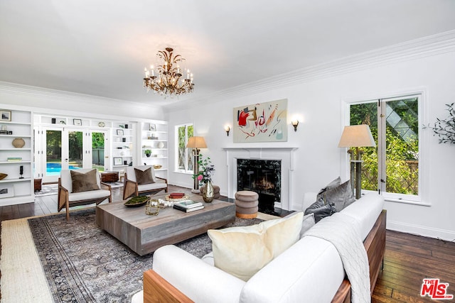 living room featuring french doors, a high end fireplace, dark hardwood / wood-style flooring, and ornamental molding