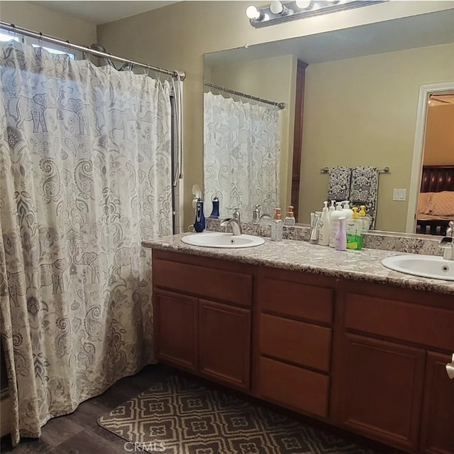 bathroom featuring dual vanity