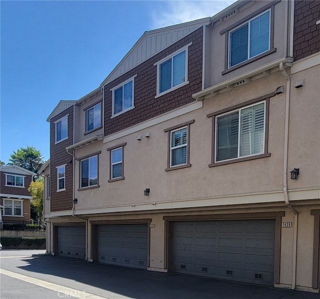 view of side of home with a garage