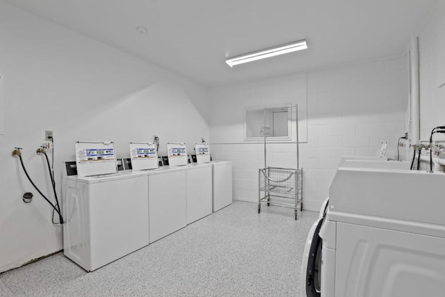 laundry room with independent washer and dryer