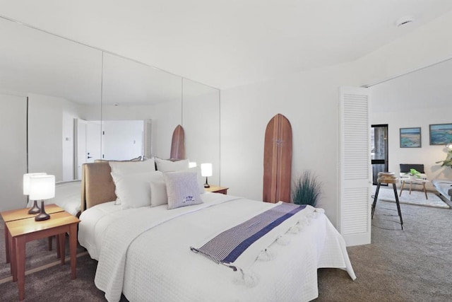 bedroom featuring dark colored carpet