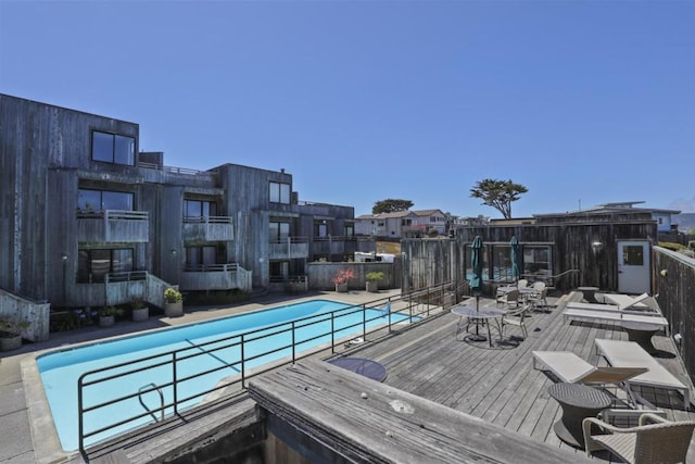 view of swimming pool with a wooden deck