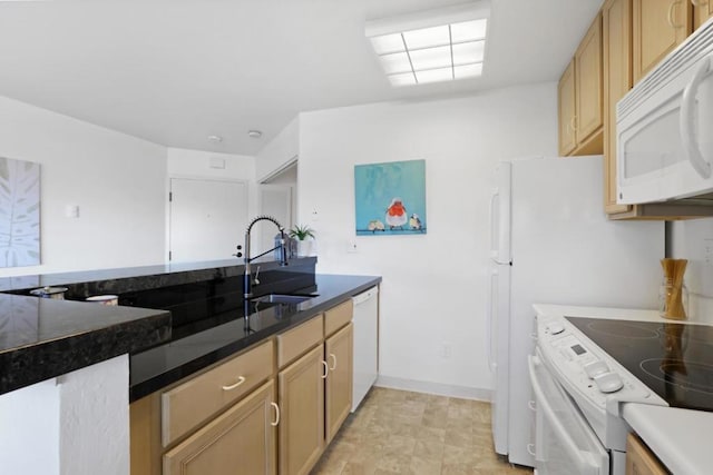 kitchen with sink, white appliances, and light brown cabinets