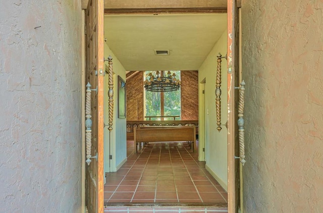 corridor with tile patterned flooring