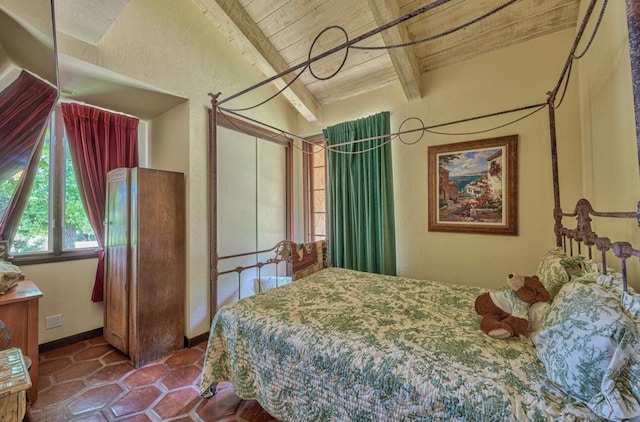 bedroom featuring lofted ceiling with beams and wood ceiling