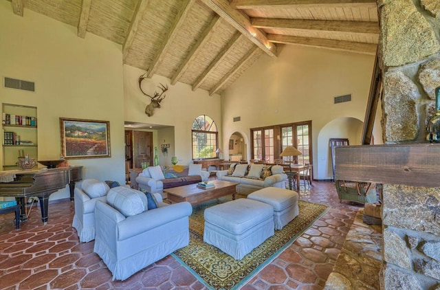 living room with high vaulted ceiling, beam ceiling, french doors, and wood ceiling