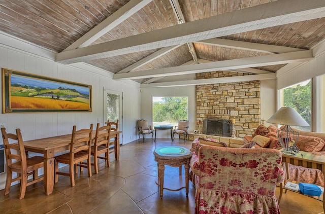 living room with a fireplace and lofted ceiling with beams