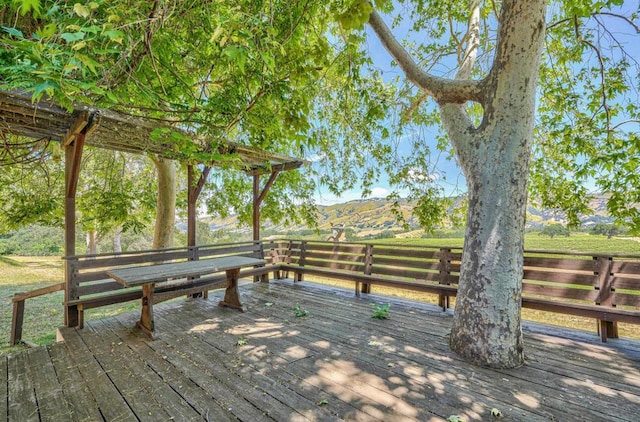 wooden deck featuring a mountain view