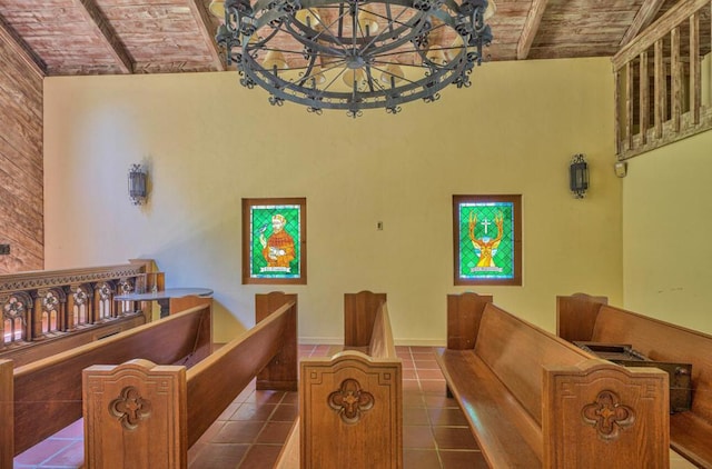 interior space with lofted ceiling with beams, an inviting chandelier, and wooden ceiling