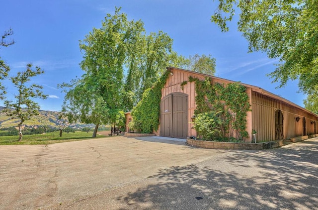 exterior space featuring a mountain view and an outbuilding