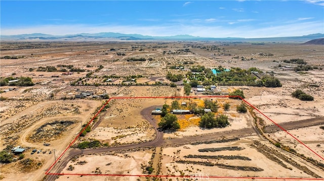 birds eye view of property featuring a mountain view