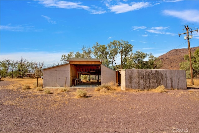 view of outbuilding with a mountain view