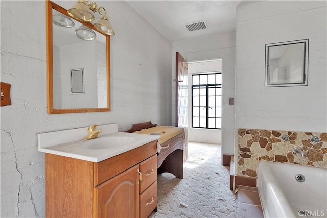 bathroom with vanity and a bathing tub