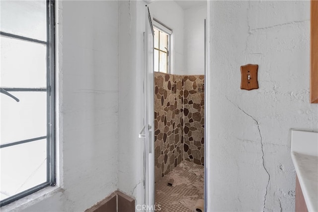 bathroom featuring tiled shower