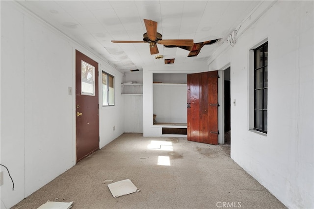 unfurnished room featuring ceiling fan