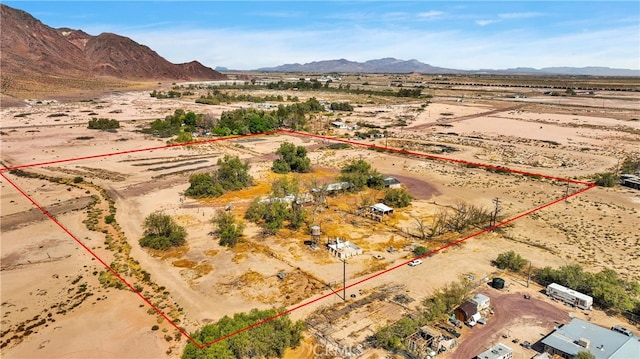 birds eye view of property with a mountain view