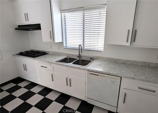 kitchen with white cabinets, white dishwasher, black gas cooktop, and sink