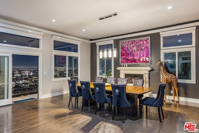 dining room with dark hardwood / wood-style flooring and ornamental molding