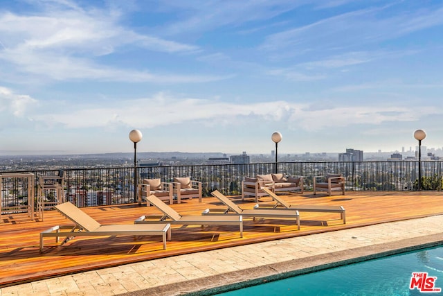 view of pool featuring a wooden deck