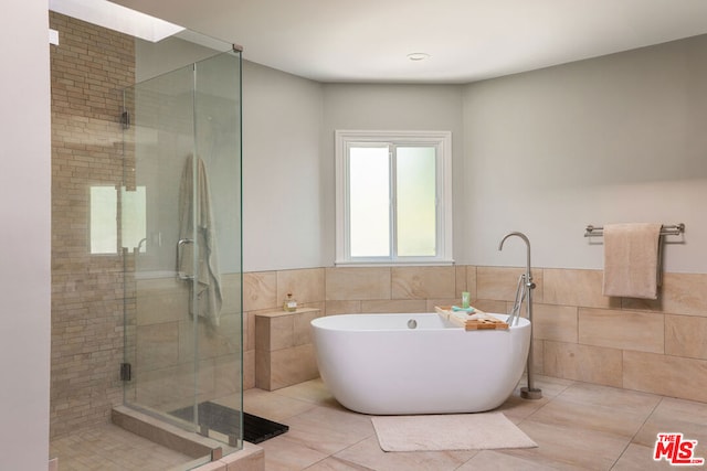 bathroom with plus walk in shower and tile patterned flooring