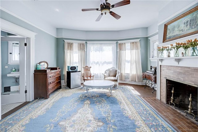 455 W 20th St, Merced, CA 95340 - living area featuring ceiling fan and a fireplace