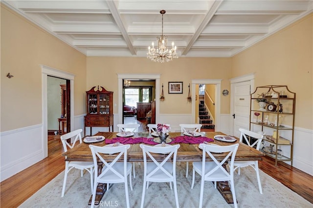 455 W 20th St, Merced, CA 95340 - dining area featuring coffered ceiling, a notable chandelier, beamed ceiling, and light wood-type flooring