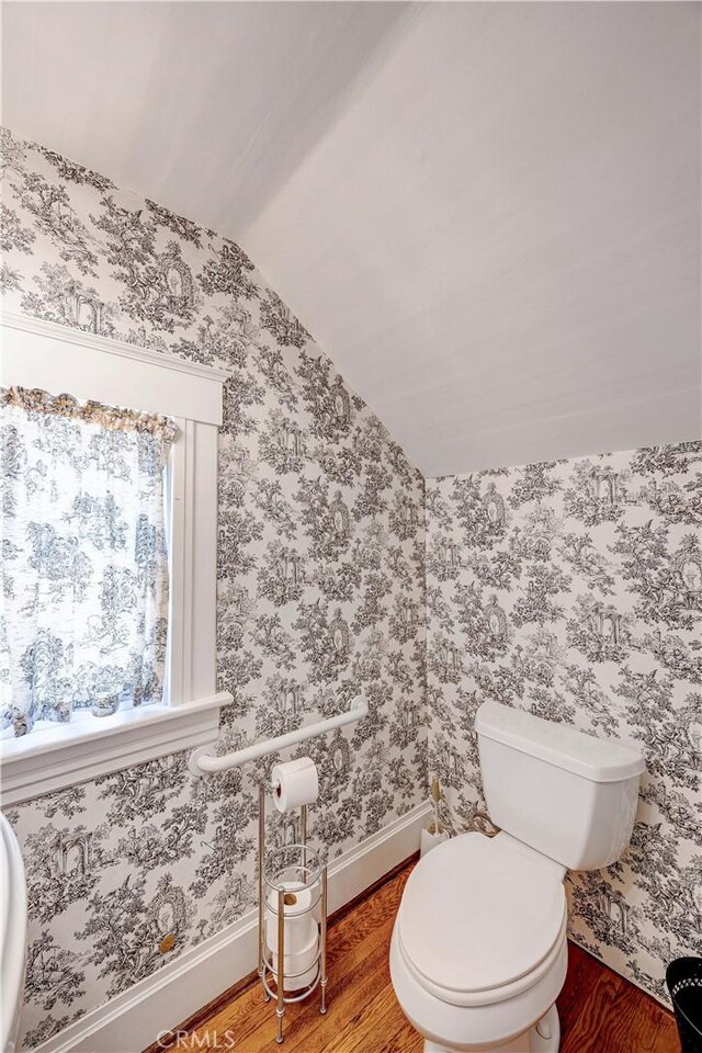 455 W 20th St, Merced, CA 95340 - bathroom with wood-type flooring, lofted ceiling, and toilet