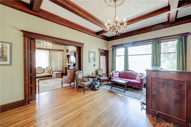 455 W 20th St, Merced, CA 95340 - sitting room with coffered ceiling, a chandelier, light wood-type flooring, ornamental molding, and beam ceiling
