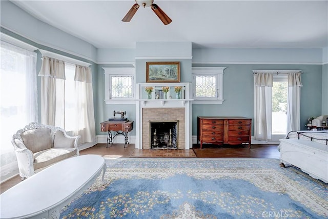 455 W 20th St, Merced, CA 95340 - living room with hardwood / wood-style flooring, ceiling fan, and a brick fireplace